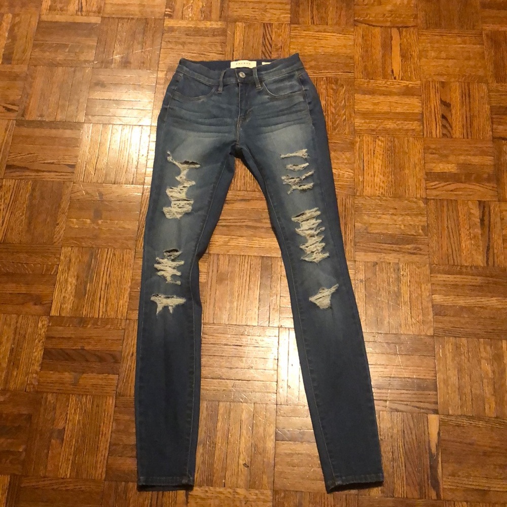 Distressed denim jeans